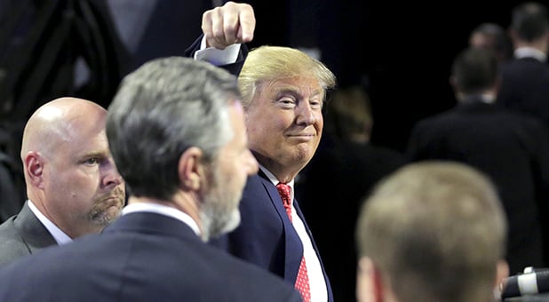Trump points an anointing finger at Jerry Falwall, Jr. after speaking in Lynchburg, Virginia, January 18, 2016. REUTERS/Joshua Roberts
